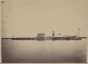 [Monitor-style ship with naval officers on deck]