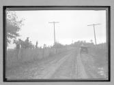 [auto on country road & horse & wagon]