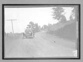 [auto on country road]