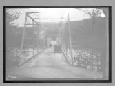 [auto tour auto, horse & wagon crossing bridge]