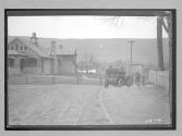 [auto in front of a house]