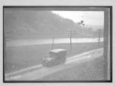 [auto driving along river]
