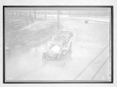 [auto driving though flooded area]