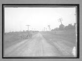 [auto on country road "#63"]