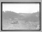 [auto on country road]