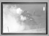 [four autos reving engines at track]