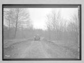 [auto on country road]