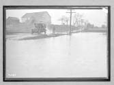[auto drivng by flooded area]