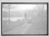 [auto driving near river]