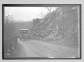 [auto driving on country road]