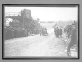 [auto racing across start-finish line "#4"]