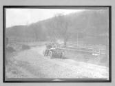 [auto racing on country road "#20"]