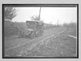 [auto driving on rutted country road "Premier"]