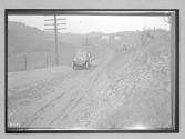 [auto driving on country road]
