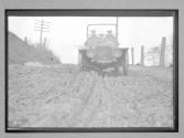 [auto driving on rutted country road "Premier"]