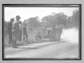 [auto racer fixing flat tire "#6"]