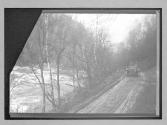 [auto driving on country road near river]