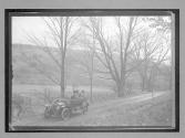 [auto parked on country road]