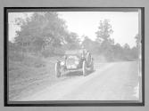 [auto riving on country road]