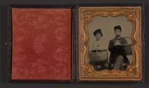 [Two men holding baskets]