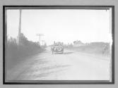 [auto driving on country road]