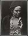 [Woman with frightened expression.]