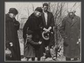 [Virginia Stevens with child clutching side at cemetery set during the filming of "Native Lands."]