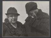 [Two women crying on the cemetery set of the film "Native Lands."]