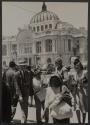 [American tourists amidst Native Mexicans on the streets of Mexico City]