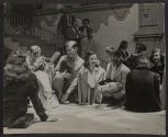[Group of men and women talking and smiling.]