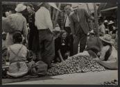 [American tourists at outdoor Mexican market]