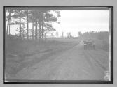 [auto driving on country road]