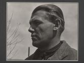 [Portrait of a man with sky in background on the set of the film Native Land.]