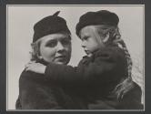 [Virginia Stevens carrying young girl in cemetery scene of "Native Land."]