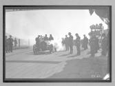 [judges inspecting auto at racetrack "#1"]