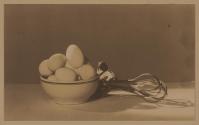 [Bowl of eggs and rotary beater]