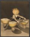 [Doll with onion head playing onion drums]