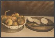 [Bowl of onions and sliced onion on cutting board]