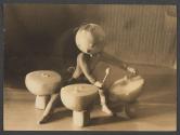 [Doll with onion head playing onion drums]