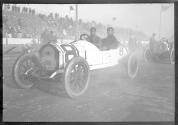 [auto racers in auto at track "#8"]