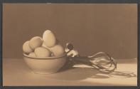 [Bowl of eggs and rotary beater]
