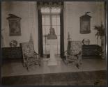 [Bust between two chairs, Harbor Hill, Long Island]