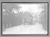 [auto racer surrounded by spectators "#22"]