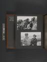 [Marion Michelle and women talking while group looks at photographs] \ [Marion Michelle and woman smiling]