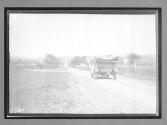 [auto tour driving on country road]