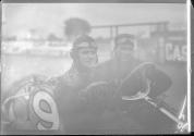 [close-up of auto racers "#9"]