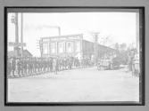 [auto tour in town passing military men "#68"]