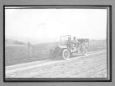 [auto driving on country road]