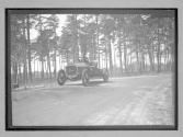 [auto driving on country road "The Acme"]