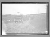 [auto tour driving on country road]
